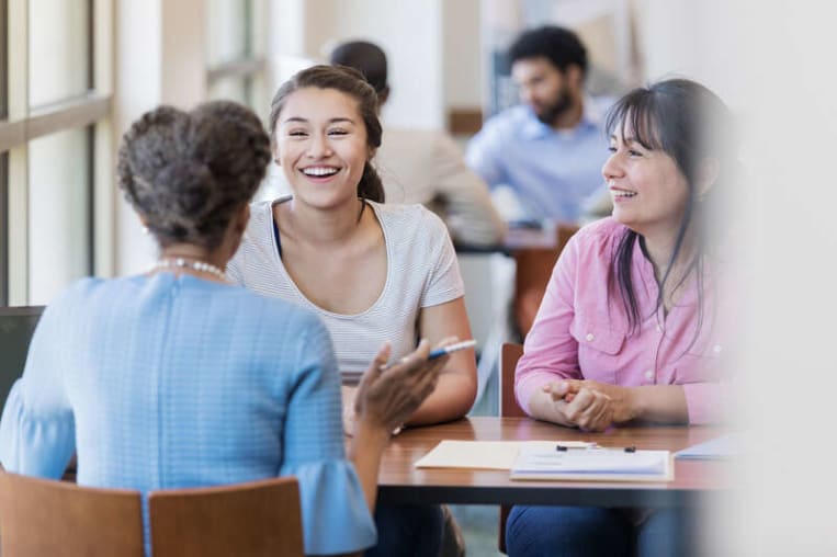 college students sitting together on campus
