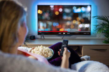 woman using streaming service from her living room