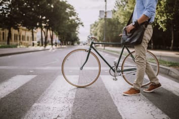 man riding bike in city
